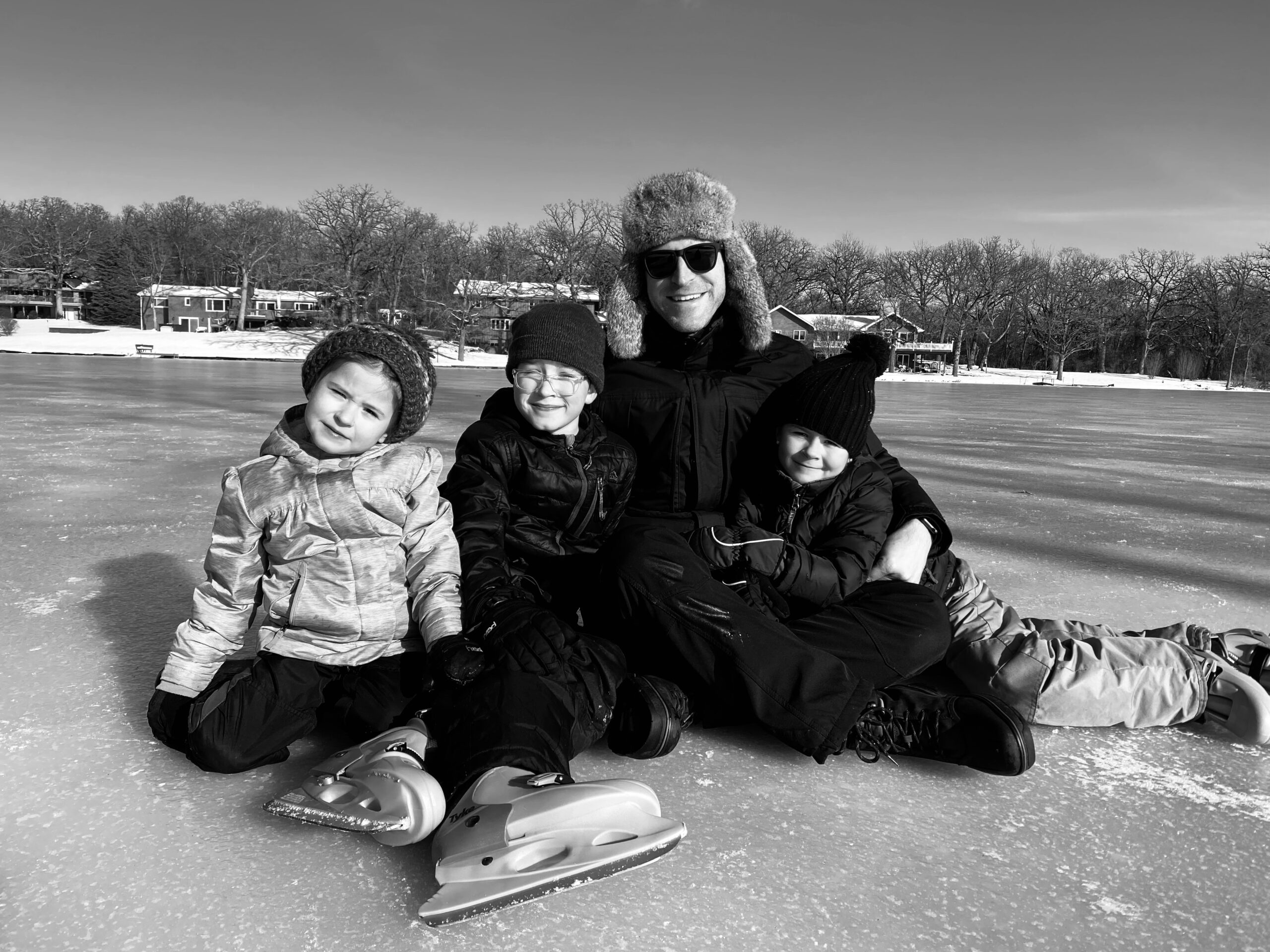 a family poses for a photo after ice skating